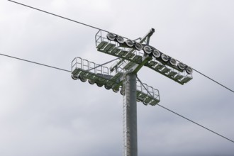 A cable car support with steel cables in a cloudy sky, Jennerbahn am Königsee, Königsee,