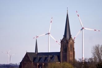 St James the Elder Catholic Church in front of wind turbines, Jüchen, Rhein-Kreis Neuss, North