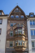 House facade, historic town house, town house with bay window in the historic old town of