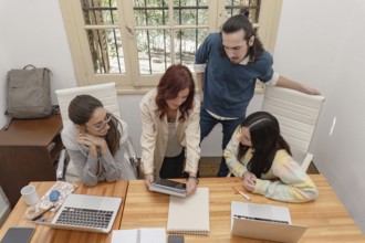 A diverse group of professionals collaborating in a modern office environment, reviewing documents