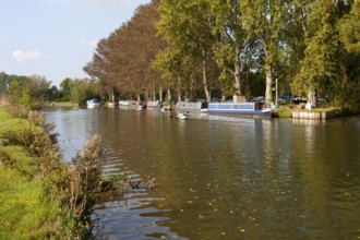 Boats on the River Thames in autumn at Lechlade on Thames, Gloucestershire, England, UK