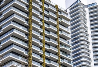 Facade of the Eden Tower on Europa-Allee in Frankfurt am Main, green facade, residential building,