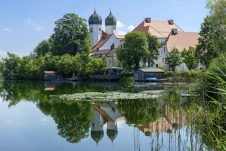 Romanesque Benedictine abbey Seeon monastery, monastery church St. Lambert, reflection in the