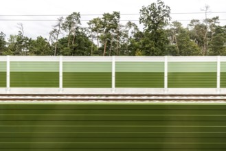 Noise barrier as a contrast to the forest, Nuremberg-Bamberg railway line near Strullendorf, Upper