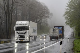 Traffic on a country road in the rain, B229, spring, near Radevormwalde, Oberbergischer Kreis,