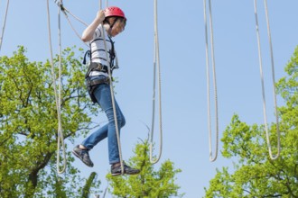 Young girl in climbing park, climbing, action, safety, belay, belay rope, belay technique, belay