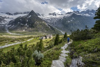 Mountaineer barefoot on a hiking trail, mountain hut Berliner Hütte, mountain peak Steinmandl,