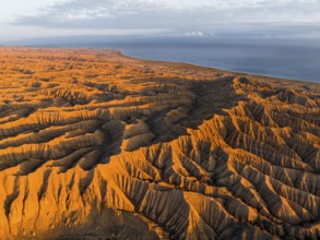 Landscape of eroded hills at Lake Issyk Kul, Badlands at sunrise, aerial view, Canyon of the