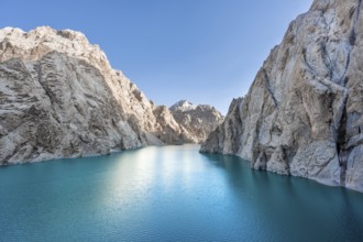 Turquoise mountain lake Kol Suu with rocky steep mountains, Kol Suu Lake, Sary Beles Mountains,