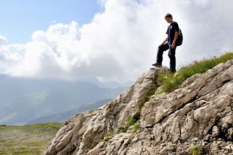 Ten-year-old boy hiking, Nebelhorn, Allgäu Alps, Bavaria, Germany, Europe