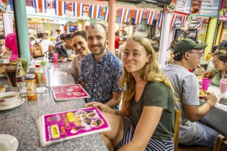 Tourists sitting at a table at a food stall, Mercado Central de San José, San José, Costa Rica,