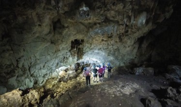 Tourists in a stalactite cave, Terciopelo Cave, Barra Honda National Park, Costa Rica, Central