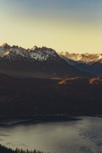 Trail running in autumn on the Jochberg on Lake Walchensee against the wonderful backdrop of the