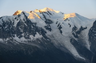 Morning atmosphere, mountain landscape at sunrise, glaciated mountain peak of Mont Blanc in the