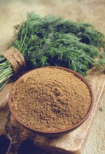 Dried dill, in a ceramic bowl, a bunch of fresh dill, seasoning, top view, no people