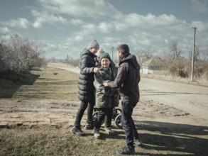 Welcoming relatives in a village near the front, Voloska Balakliia, Ukraine, Europe