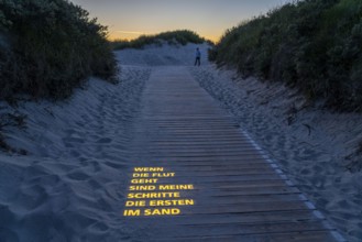 North Sea island Langeoog, beach access with luminous poem, light installation, When the tide goes