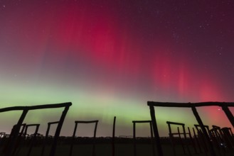 Northern lights (aurora borealis) over the ring sanctuary of Pömmelte, prehistoric circular ditch