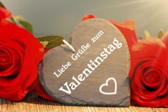 Greetings for Valentine's Day: roses and a heart with the inscription LOVE GREETINGS FOR