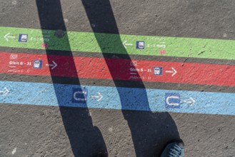 Signpost on the pavement, for bus and train diversions at Dortmund Central Station, during