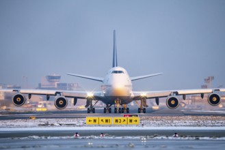 Lufthansa Boeing 747-8, on the taxiway to Runway West, Frankfurt FRA Airport, Fraport, in winter,