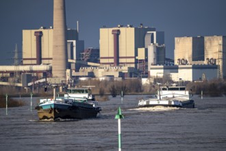 Cargo ships on the Rhine near Rheinberg, in the background the decommissioned Voerde coal-fired