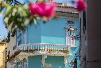 Colourful facade with balcony, flowers, turquoise, colourful, Elba, Tuscany, Italy, Europe