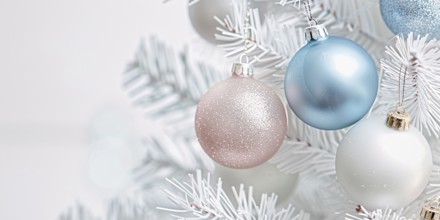 Close up of beautiful iridescent bauble ornaments on branches of white christmas tree. Generative