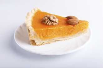 A slice of traditional american sweet pumpkin pie isolated on white background. close up