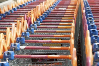 Close up of shopping trolleys outside a Sainsburys store in England