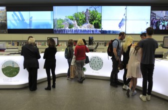 People inside tourist information office, Plaza Mayor, Madrid city centre, Spain, Europe