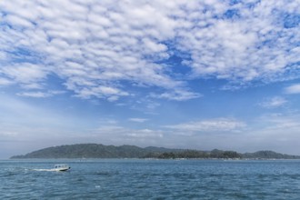 Tropical island and blue sky with clouds in the marine reserve