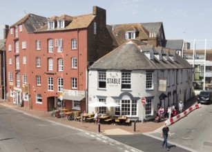 Old historic buildings on quayside at Poole harbour, Poole, Dorset, England, UK