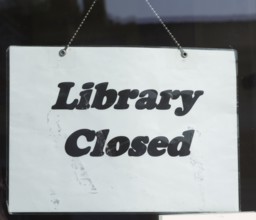 Sign saying 'Library Closed' symbolising closure of libraries as a result of austerity government