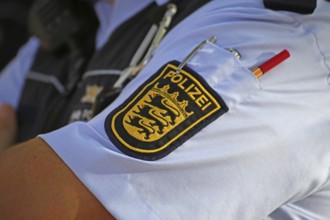 State coat of arms of Baden-Württemberg on the shirt of a policeman