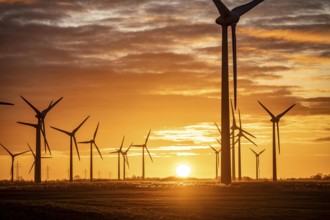 Wind farm near the East Frisian town of Norden, east of the town, sunset, Lower Saxony, Germany,