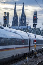 ICE train on the track in front of Cologne Central Station, Hohenzollern Bridge, Cologne Cathedral,