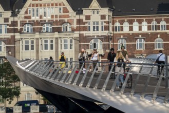 Cyclists on the Lille Langebro cycle and pedestrian bridge over the harbour, Copenhagen is