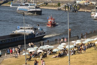 The city beach on the Rhine near Düsseldorf, riverside promenade, by the Rheinkniebrücke bridge,