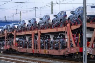 Car train, goods train on its way to the car terminal in Bremerhaven seaport, new German cars for