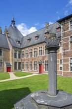 1758 pillory in courtyard at Kasteel van Laarne, 14th century medieval moated castle near Ghent,