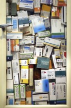 Medicine cabinet filled with medication boxes, drugs for treating mental diseases