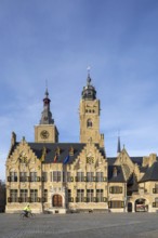 Market square showing town hall with belfy and St Nicholas Church tower, rebuilt after WWI in the