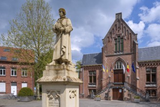 Statue of Gabriel Mudeus on the town square and former city hall in neo-Gothic style in the