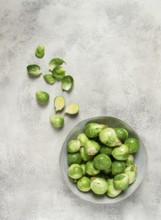 Fresh Brussels sprouts, raw, top view, on a gray table, no people