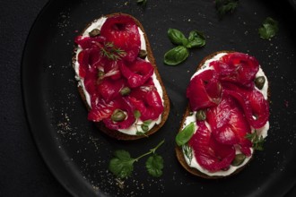 Sandwiches with gravlax salmon, cream cheese, capers, greens, breakfast, homemade