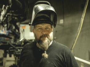 Welder in a tunnel section of the double shield tunnel boring machine in the H53 construction lot