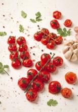 Baked branch, mini, cherry tomatoes, with spices and herbs, garlic, food background, top view, on a