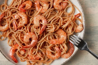 Spaghetti with king shrimps, with spices, top view, selective focus, homemade, no people