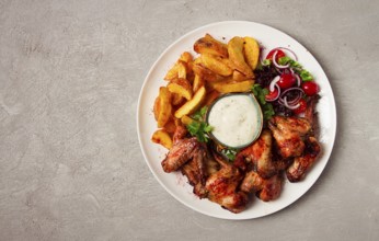 Fried chicken wings, with potatoes, and spices, homemade, fast food, no people